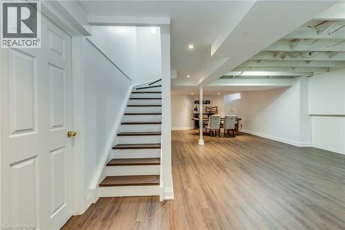 A spacious area featuring light wood-look flooring, white walls, and recessed lighting - 3311 Springvale Court, Burlington, ON - Indoor Photo Showing Other Room