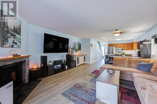 19 - 2 Paradise Boulevard, Ramara, ON - Indoor Photo Showing Living Room With Fireplace