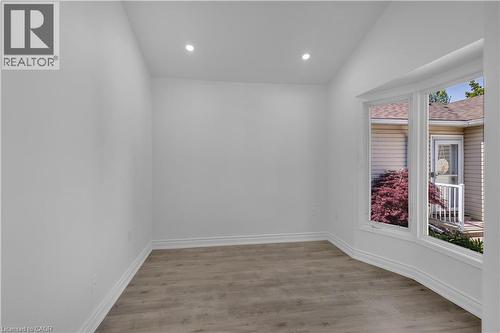 Bright interior space featuring a bay window, recessed ceiling lighting, and wood-finish flooring - 375 Silverbirch Boulevard, Hamilton, ON - Indoor Photo Showing Other Room