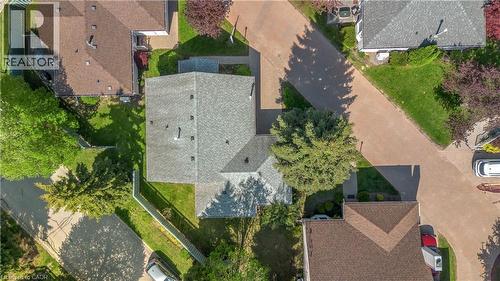 Aerial perspective highlighting a property with a light gray shingle roof and surrounding green lawn - 375 Silverbirch Boulevard, Hamilton, ON - Outdoor With View