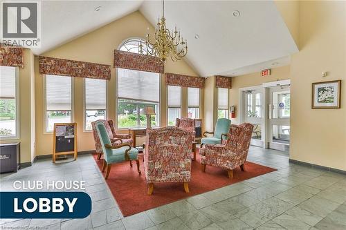 Spacious lobby featuring a vaulted ceiling and a prominent chandelier - 375 Silverbirch Boulevard, Hamilton, ON - Indoor Photo Showing Living Room