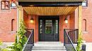 Brick facade featuring a covered front entry with natural wood ceiling - 41 Talbot Road, Delhi, ON  - Outdoor With Exterior 