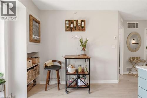 Light wood-finish flooring extending throughout the space - 1411 Walker'S Line Unit# 105, Burlington, ON - Indoor