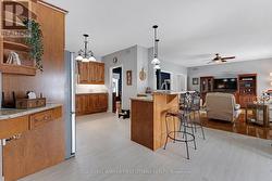 Kitchen looks out over living room and the water - 