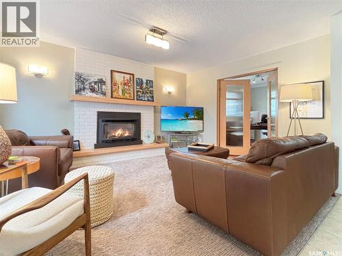 355 Ball Crescent, Saskatoon, SK - Indoor Photo Showing Living Room With Fireplace
