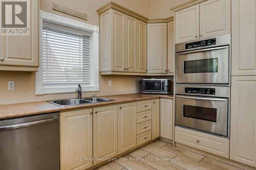 1107 Tiny Beaches Road S, Tiny, ON - Indoor Photo Showing Kitchen With Double Sink