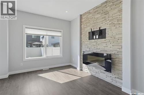 348 Brighton Gate, Saskatoon, SK - Indoor Photo Showing Living Room With Fireplace