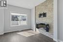 348 Brighton Gate, Saskatoon, SK  - Indoor Photo Showing Living Room With Fireplace 