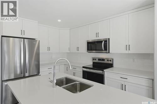 348 Brighton Gate, Saskatoon, SK - Indoor Photo Showing Kitchen With Double Sink With Upgraded Kitchen