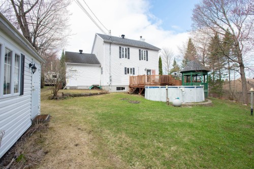 Face arrière - 9 Rue Elm, Shannon, QC - Outdoor With Above Ground Pool