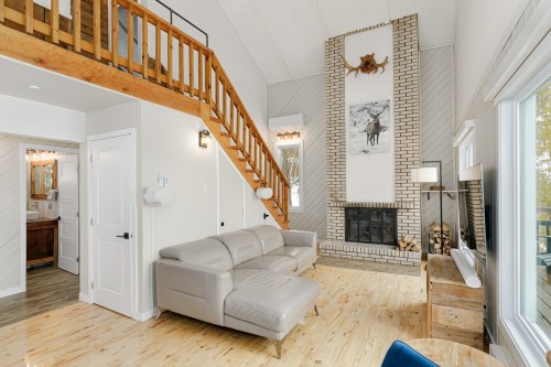Living Room - 115  - 115A Rue Diana, Sainte-Agathe-Des-Monts, QC - Indoor With Fireplace