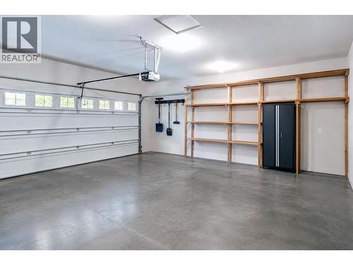VIRTUALLY STAGED - 4520 Gallaghers Lookout Unit# 4, Kelowna, BC - Indoor Photo Showing Garage
