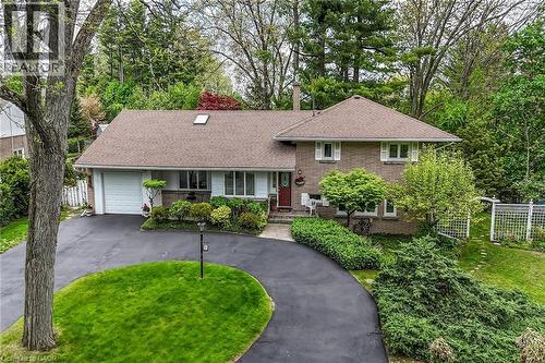 Brick and siding exterior featuring a brown shingle roof with skylight - 2 Summit Circle, Simcoe, ON - Outdoor