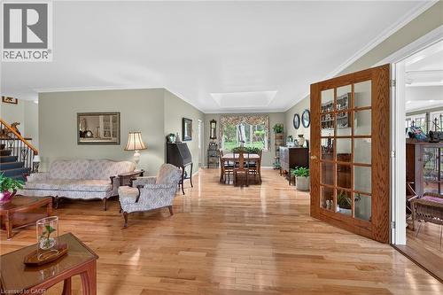 Hardwood flooring extends throughout this expansive main living area - 2 Summit Circle, Simcoe, ON - Indoor Photo Showing Living Room
