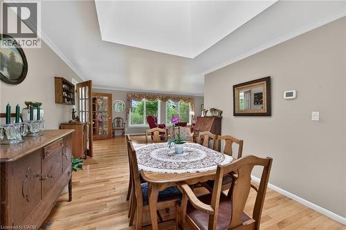 Dining area with hardwood flooring and a vaulted ceiling - 2 Summit Circle, Simcoe, ON - Indoor Photo Showing Dining Room