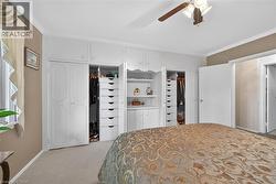 Built-in white cabinetry with a central shelving unit - 