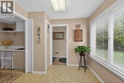 Spacious room with patterned vinyl flooring and neutral wall tones - 