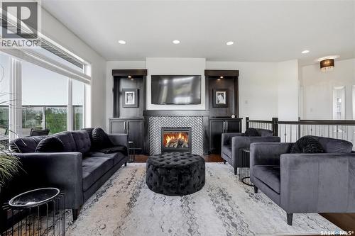2431 Linner Bay, Regina, SK - Indoor Photo Showing Living Room With Fireplace