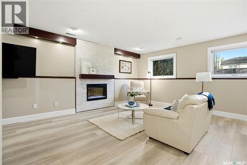 239 Scissons Court, Saskatoon, SK - Indoor Photo Showing Living Room With Fireplace