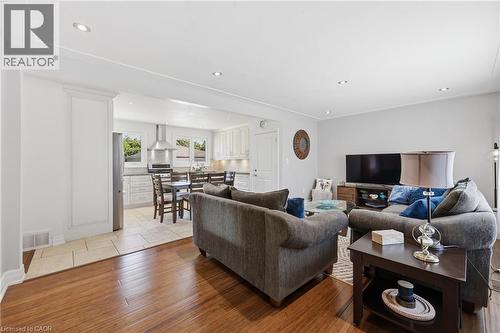 Open-concept living space featuring wood-finish flooring, recessed lighting, and white trim molding - 168 Nugent Drive, Hamilton, ON - Indoor Photo Showing Living Room