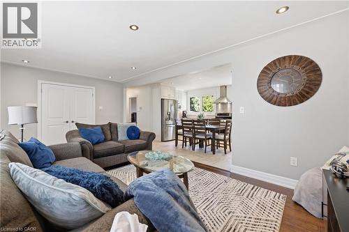 Living space featuring recessed lighting, wood-finish flooring, and light gray wall tones - 168 Nugent Drive, Hamilton, ON - Indoor Photo Showing Living Room