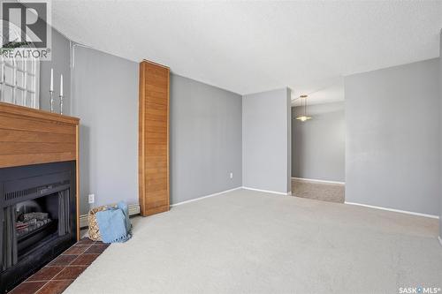 214 207C Tait Place, Saskatoon, SK - Indoor Photo Showing Living Room With Fireplace