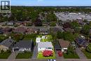Single-story residence with a gray exterior, dark roof, and a prominent red tree in the front yard - 94 Clarendon Avenue, Hamilton, ON  - Outdoor With View 