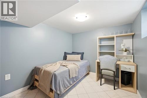 Light-filled room featuring neutral wall tones and a tiled floor - 94 Clarendon Avenue, Hamilton, ON - Indoor Photo Showing Bedroom