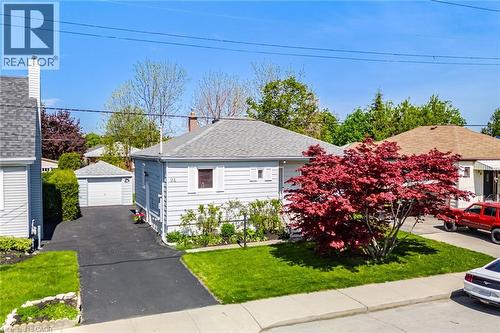Single-story residence featuring light gray siding and a gray shingle roof - 94 Clarendon Avenue, Hamilton, ON - Outdoor