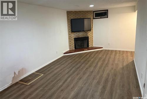 1341 9Th Avenue N, Regina, SK - Indoor Photo Showing Living Room With Fireplace