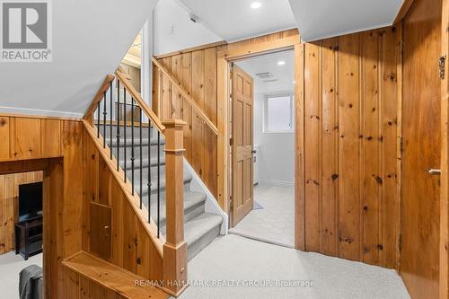 Ground Level with Wood Accent Walls - 1981 Navaho Drive, Ottawa, ON - Indoor Photo Showing Other Room