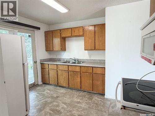 7 Dunfield Crescent, Meadow Lake, SK - Indoor Photo Showing Kitchen With Double Sink
