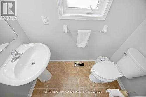 Powder room on main level - 3935 Skyview Street, Mississauga, ON - Indoor Photo Showing Bathroom