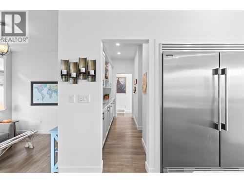 Entrance to pantry space from kitchen - Main floor. - 647 Mt Ida Drive, Coldstream, BC 