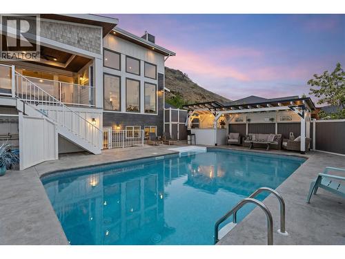 Pool view up to front of home. - 647 Mt Ida Drive, Coldstream, BC 
