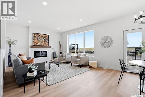 3 Walker Way, Clavet, SK - Indoor Photo Showing Living Room With Fireplace