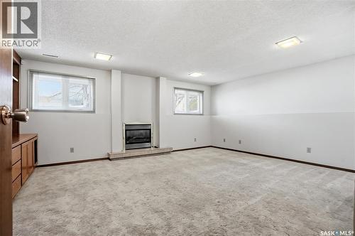227 Flavelle Crescent, Saskatoon, SK - Indoor Photo Showing Other Room With Fireplace