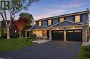 Two-story residence featuring a dark blue siding and a stonework facade - 3500 Regal Road, Burlington, ON  - Outdoor With Deck Patio Veranda 