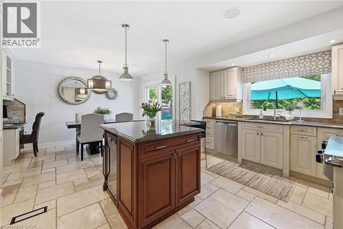 Open-concept kitchen and dining area featuring light-toned tile flooring - 3500 Regal Road, Burlington, ON - Indoor Photo Showing Kitchen With Upgraded Kitchen
