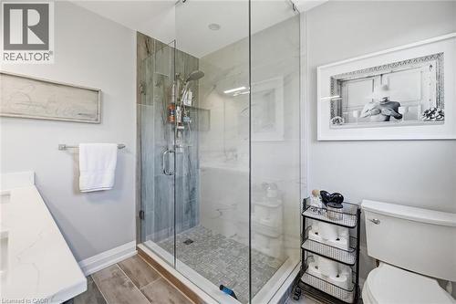 Contemporary shower enclosure featuring clear glass panels and a chrome shower system - 3500 Regal Road, Burlington, ON - Outdoor With Deck Patio Veranda With Exterior