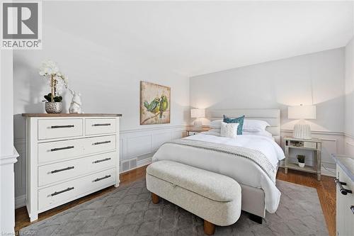 Bedroom featuring hard-surface flooring, white walls, and wainscoting - 3500 Regal Road, Burlington, ON - Indoor Photo Showing Bathroom