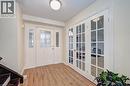 Entryway featuring wood-finish flooring and a white front door with decorative glass inserts - 519 Yorkshire Drive, Waterloo, ON  - Indoor Photo Showing Other Room 