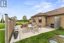 Poured concrete patio with privacy fence - 