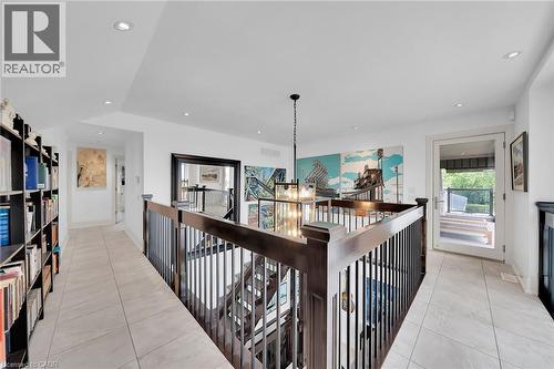 Hall featuring light tile patterned floors, recessed lighting, and a chandelier - 404 Mountain Brow Boulevard E, Hamilton, ON - Indoor Photo Showing Other Room