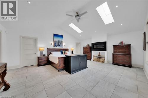 Bedroom featuring ceiling fan, vaulted ceiling, a skylight, light tile patterned flooring, and recessed lighting - 404 Mountain Brow Boulevard E, Hamilton, ON - Indoor Photo Showing Other Room