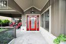 Entrance to property featuring a porch and board and batten siding - 404 Mountain Brow Boulevard E, Hamilton, ON  - Outdoor With Exterior 