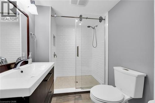 Full bathroom featuring vanity, a stall shower, dark wood-style floors, and recessed lighting - 404 Mountain Brow Boulevard E, Hamilton, ON - Indoor Photo Showing Bathroom
