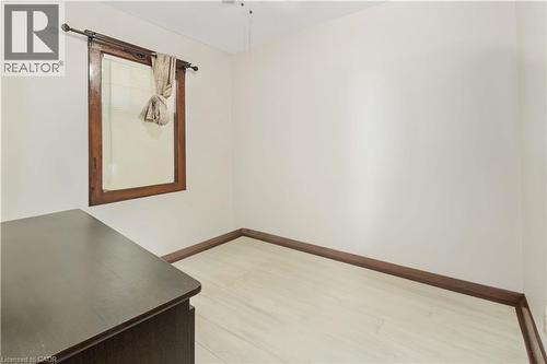 Room featuring light wood-finish flooring, white walls, and dark wood baseboards - 151 Louisa Street, Kitchener, ON - Indoor Photo Showing Other Room