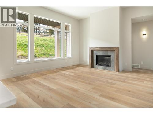 2125 Montenegro Drive, Kelowna, BC - Indoor Photo Showing Living Room With Fireplace