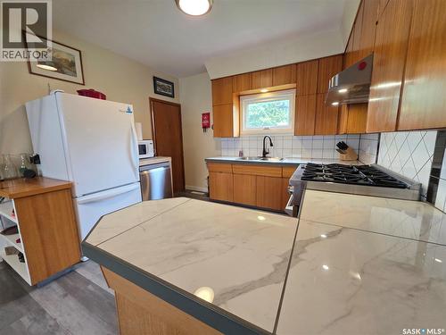 205 Warwick Street, Neville, SK - Indoor Photo Showing Kitchen With Double Sink